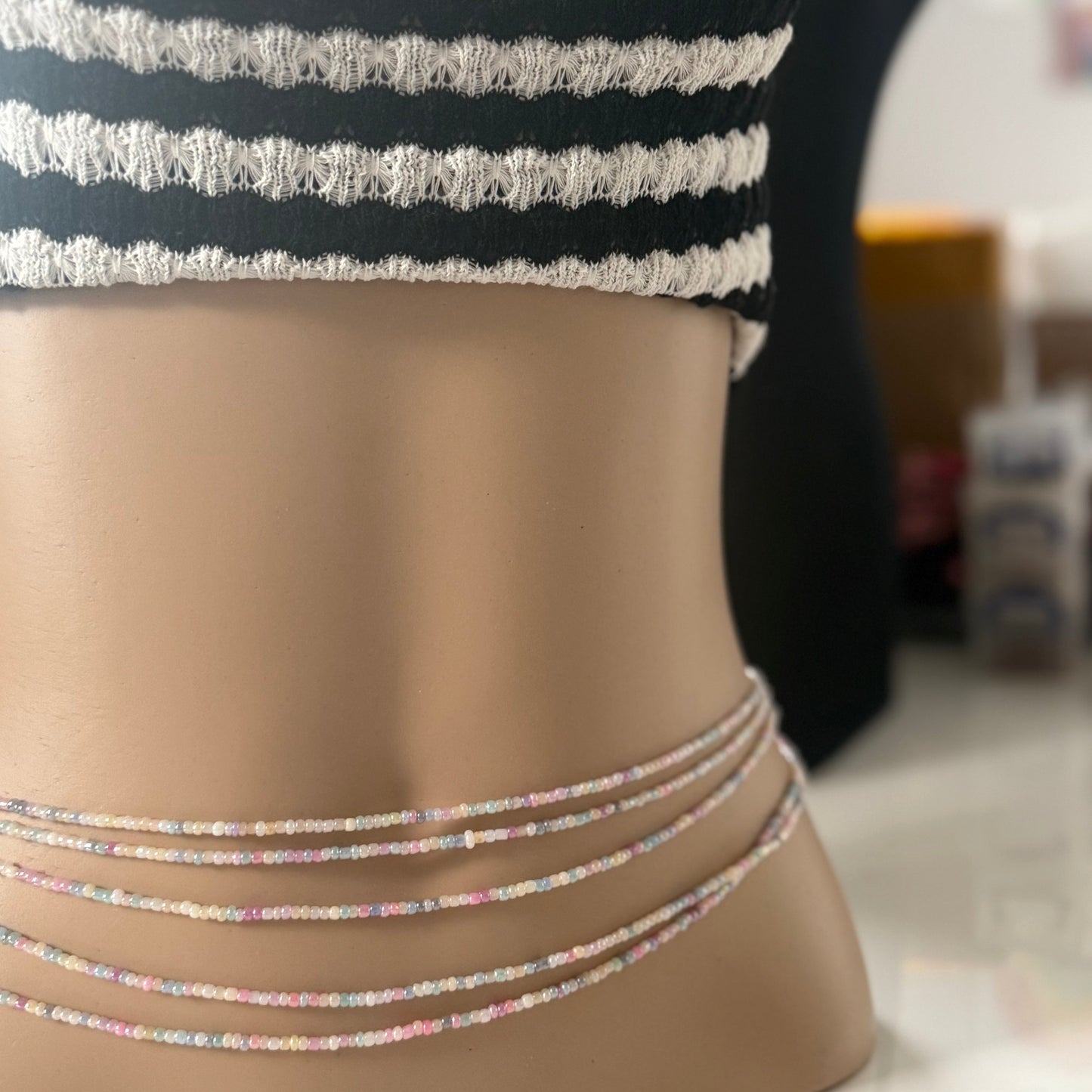 Close-up of Whispered Dream pastel waist beads featuring soft pink, lilac, baby blue, and cream glass beads. Handcrafted feminine waist jewelry designed for calm, balance, and gentle energy. Perfect accessory for women embracing softness, self-love, and everyday goddess vibes.