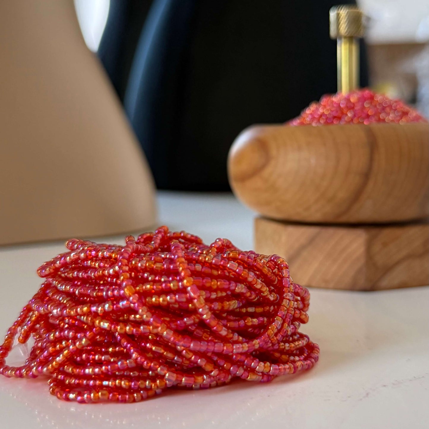 Translucent red waist beads handcrafted with vibrant red glass beads, perfect body jewelry to celebrate feminine power, passion, and confidence. Adjustable, stylish waist beads for everyday wear or special occasions.