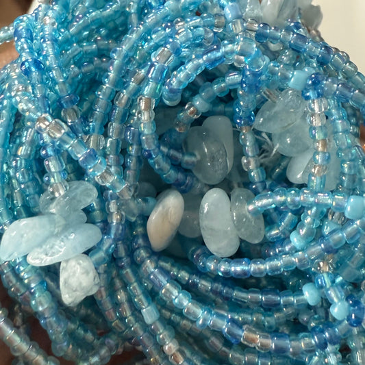 Close-up of blue beaded belly beads also known as waist beads with aquamarine stone beads