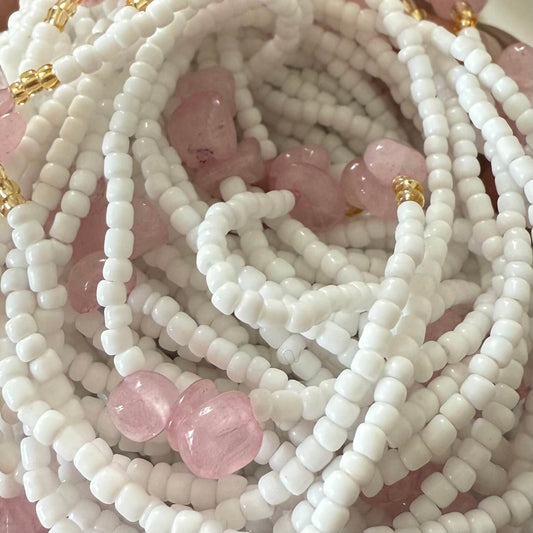 waist beads, Close-up of white and pink  rose quartz beaded waist necklace