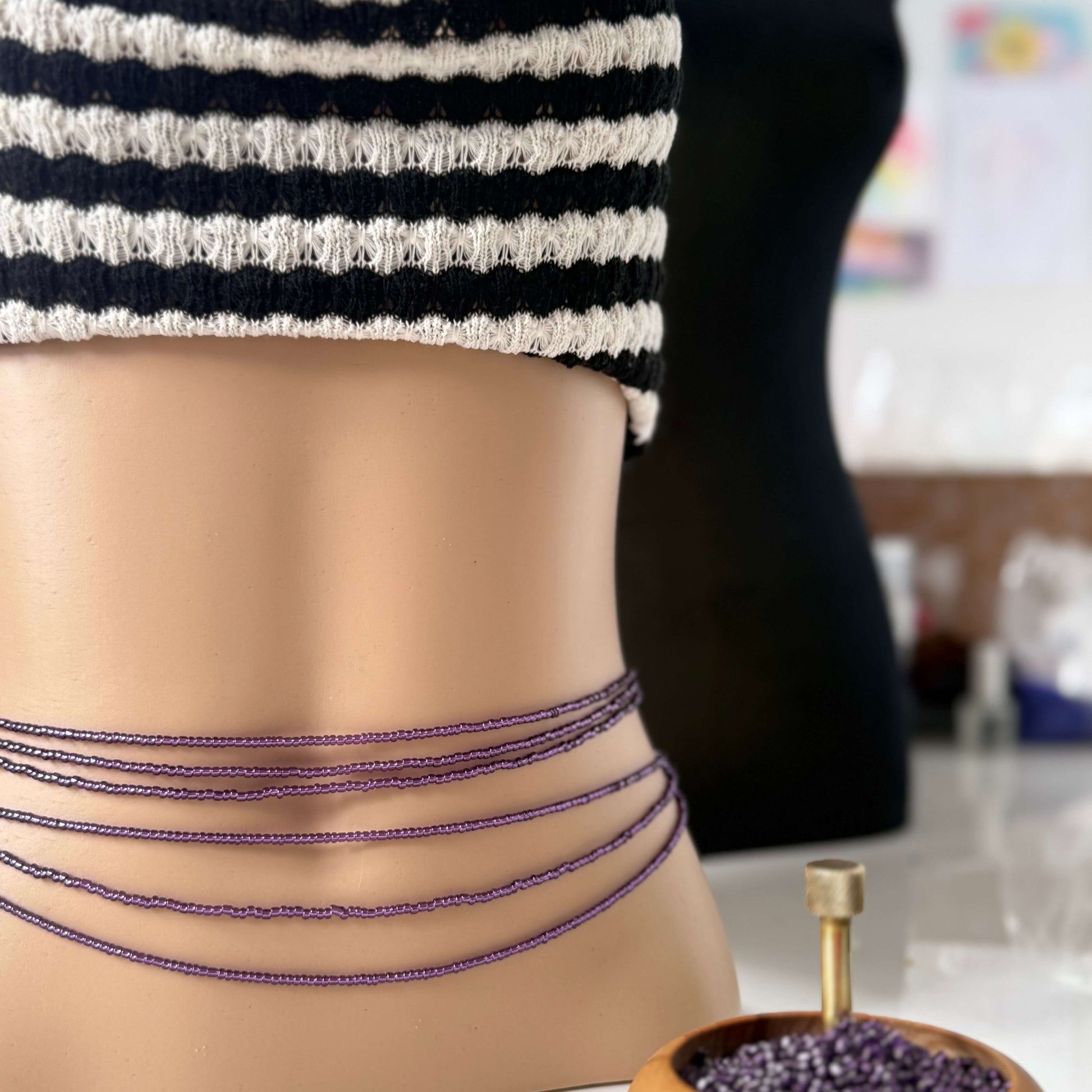 purple waist beads with clasp and tie-on options, worn as African waist beads or slimming belly beads – handmade in the UK.