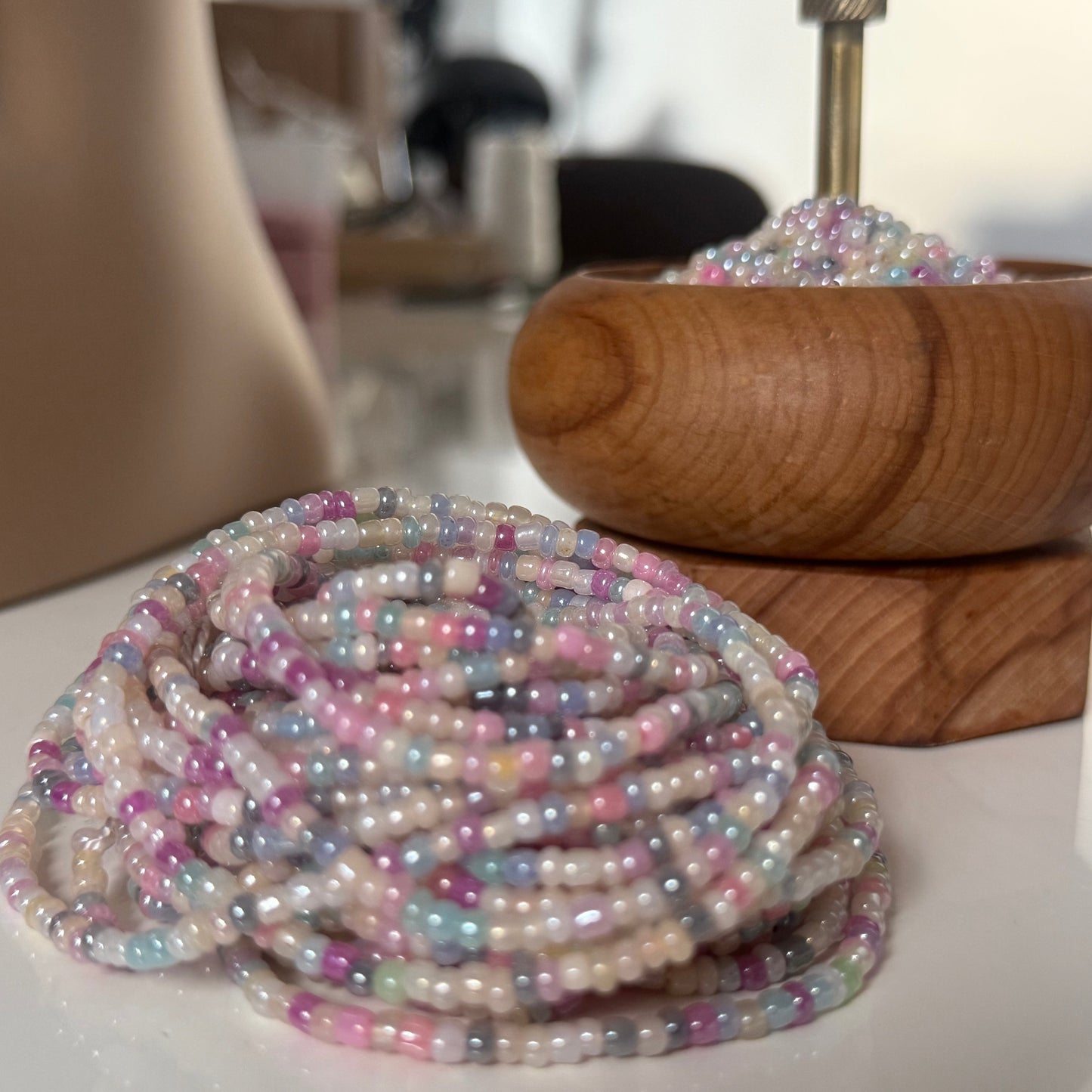 Close-up of Whispered Dream pastel waist beads featuring soft pink, lilac, baby blue, and cream glass beads. Handcrafted feminine waist jewelry designed for calm, balance, and gentle energy. Perfect accessory for women embracing softness, self-love, and everyday goddess vibes.