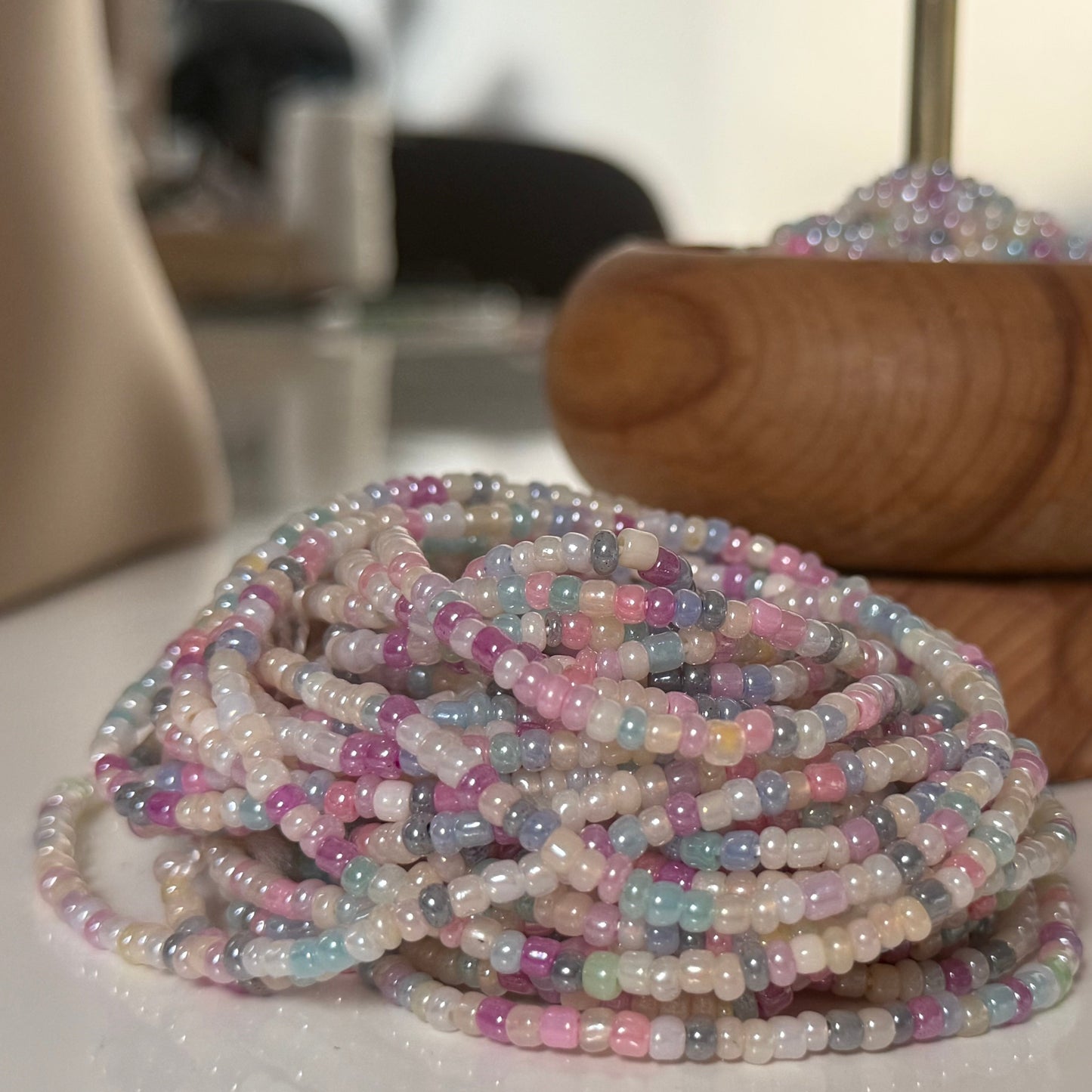 Close-up of Whispered Dream pastel waist beads featuring soft pink, lilac, baby blue, and cream glass beads. Handcrafted feminine waist jewelry designed for calm, balance, and gentle energy. Perfect accessory for women embracing softness, self-love, and everyday goddess vibes.