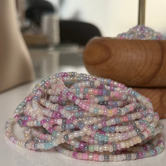 Close-up of Whispered Dream pastel waist beads featuring soft pink, lilac, baby blue, and cream glass beads. Handcrafted feminine waist jewelry designed for calm, balance, and gentle energy. Perfect accessory for women embracing softness, self-love, and everyday goddess vibes.