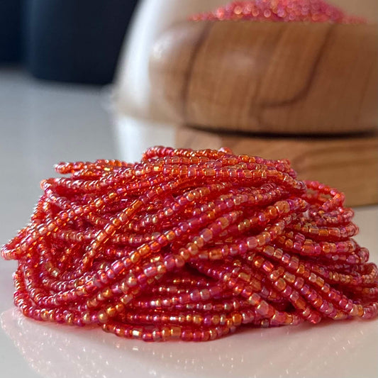 Translucent red waist beads handcrafted with vibrant red glass beads, perfect body jewellery to celebrate feminine power, passion, and confidence. Adjustable, stylish waist beads for everyday wear or special occasions.