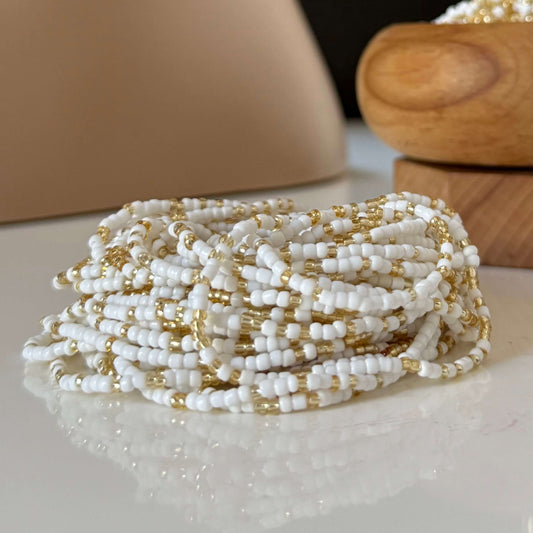 White Ember waist beads for women, handcrafted mostly with radiant white beads and subtle gold accents, symbolising clarity, peace, strength, and feminine energy.
