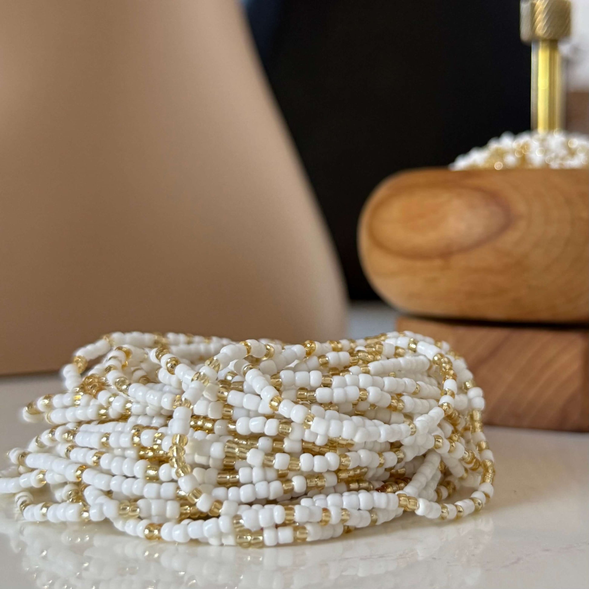 White and gold waist beads for women, handcrafted mostly with radiant white beads and subtle gold accents, symbolising clarity, peace, strength, and feminine energy.