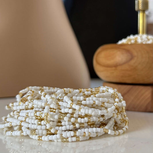 White and gold waist beads for women, handcrafted mostly with radiant white beads and subtle gold accents, symbolising clarity, peace, strength, and feminine energy.