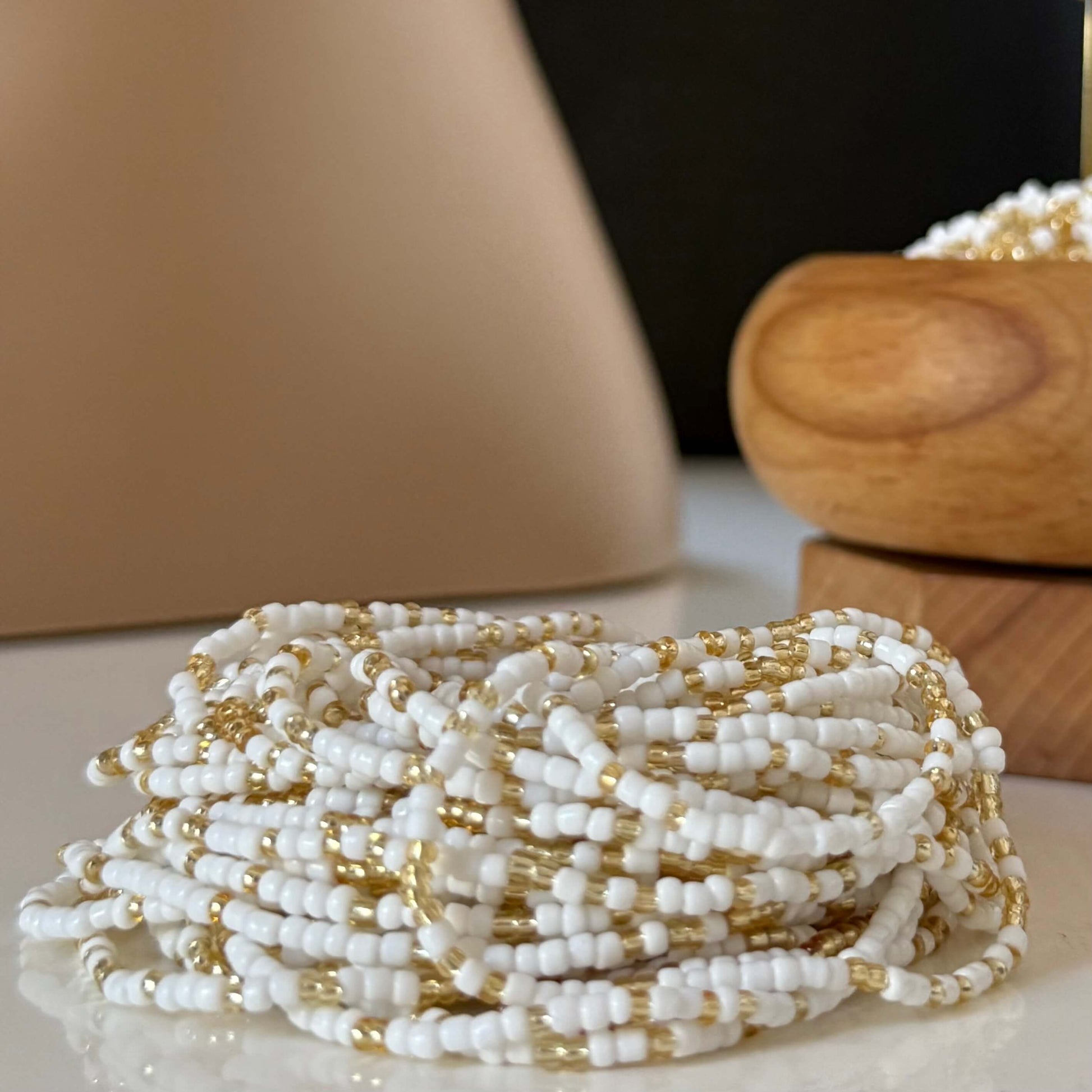 White ad gold waist beads for women, handcrafted mostly with radiant white beads and subtle gold accents, symbolising clarity, peace, strength, and feminine energy.